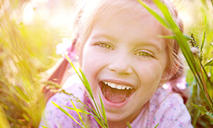 Photo of girl laughing - Pediatric dentist Dr. Tricia Ray serving Salem, Keizer, Dallas and Silverton, OR